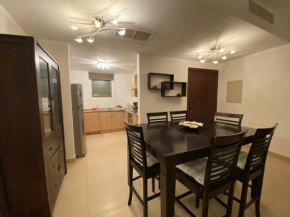 Lovely first floor tow bed rooms overviewing circular pool in Talabay Aqaba